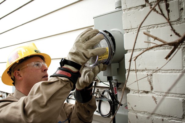 Electrician installing a meter